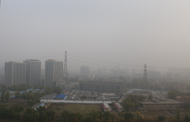 Figure 1. A typical smoggy day in Beijing, taken at noon on 11/14/2015. Low-rise buildings at the front are part of a village within city. Image Credit: Yanfei Pu