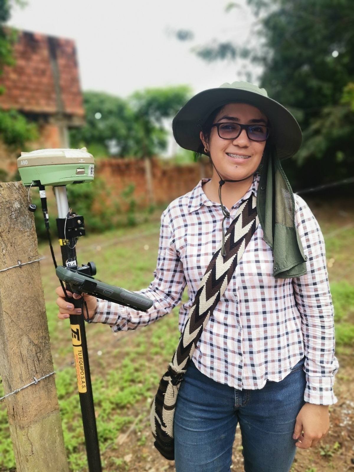 Woman topographer proves land surveyors are not limited to men.