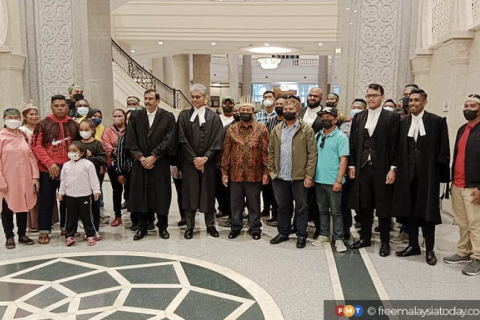 Members of the Orang Asli Seletar tribe with their lawyers at the Court of Appeal this morning.