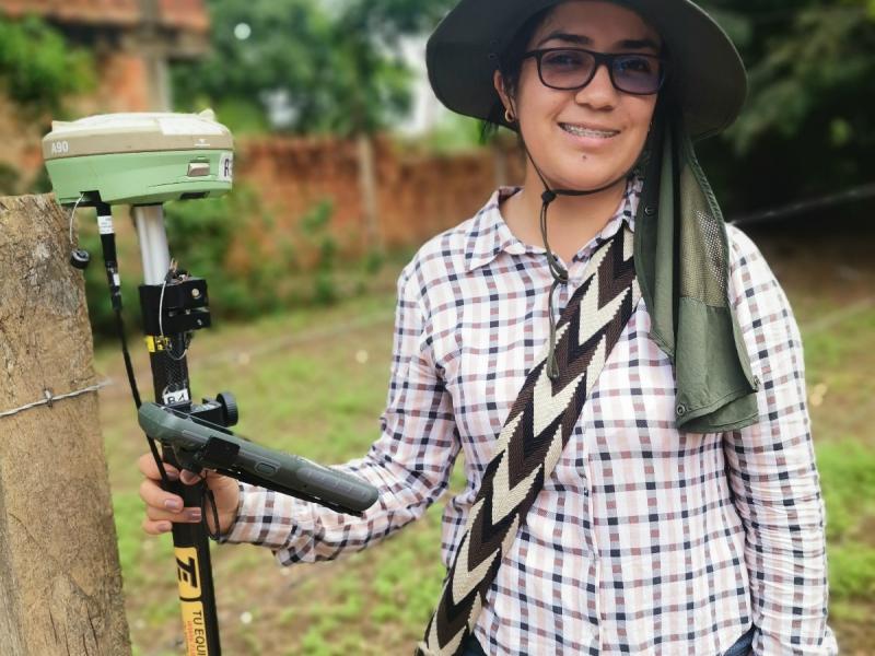 Woman topographer proves land surveyors are not limited to men.