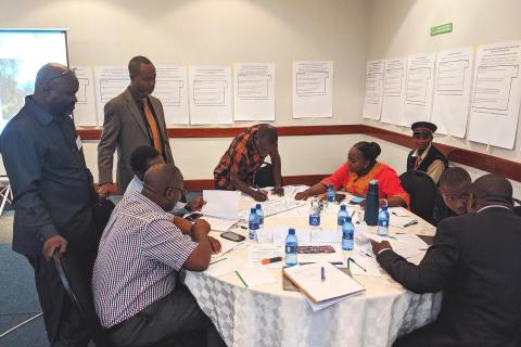 Photo 1: Community stakeholders reviewing background report of Zambian forest tenure context