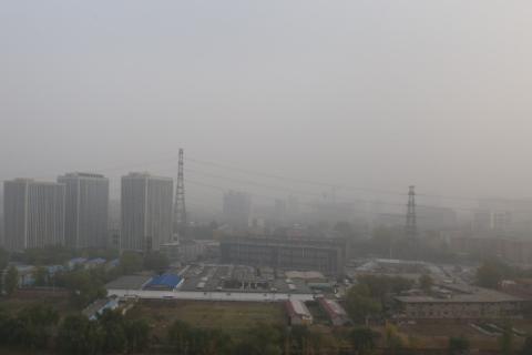 Figure 1. A typical smoggy day in Beijing, taken at noon on 11/14/2015. Low-rise buildings at the front are part of a village within city. Image Credit: Yanfei Pu