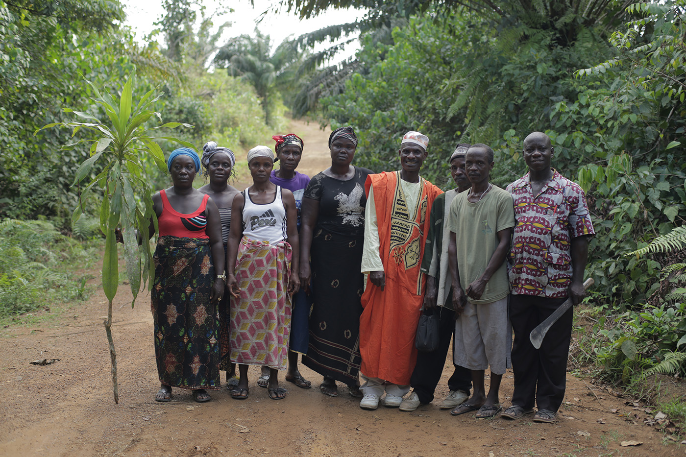 Community members in Siahn, Rivercess County, Liberia, prepare to meet with their neighbors to plant a boundary tree, supported by the Sustainable Development Institute (SDI).