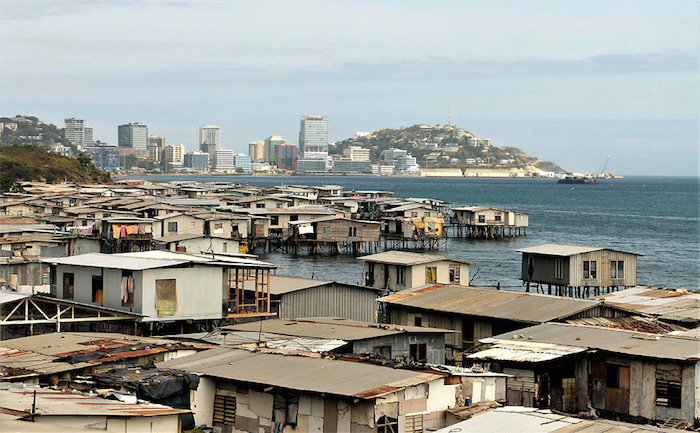 Stilt Houses Port Moresby, by gailhampshire, 2019, CC BY 2.0 license